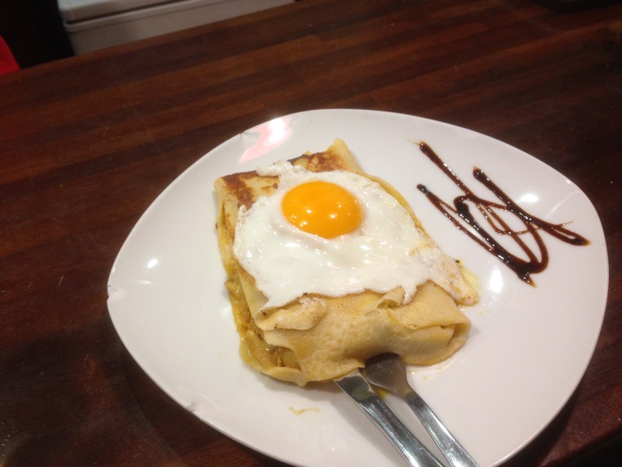 Filloa filled with chocolate and topped with an egg.